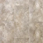 Close-up of beige, textured stone-look vinyl tiles