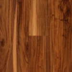 Detailed view of variegated, multi-tonal wood-look vinyl flooring.
