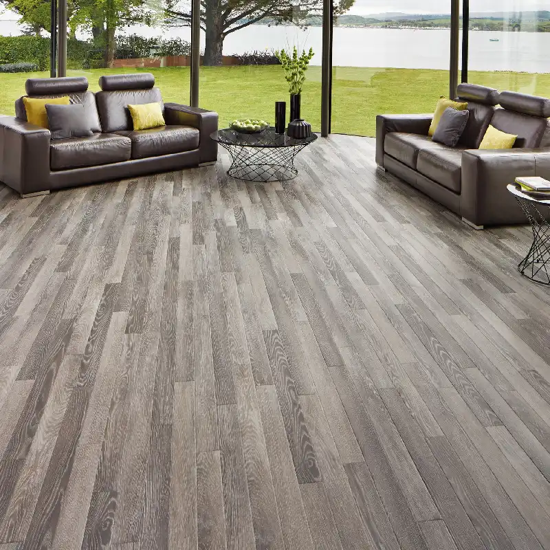 Gray wood-look vinyl plank flooring in a modern living room.