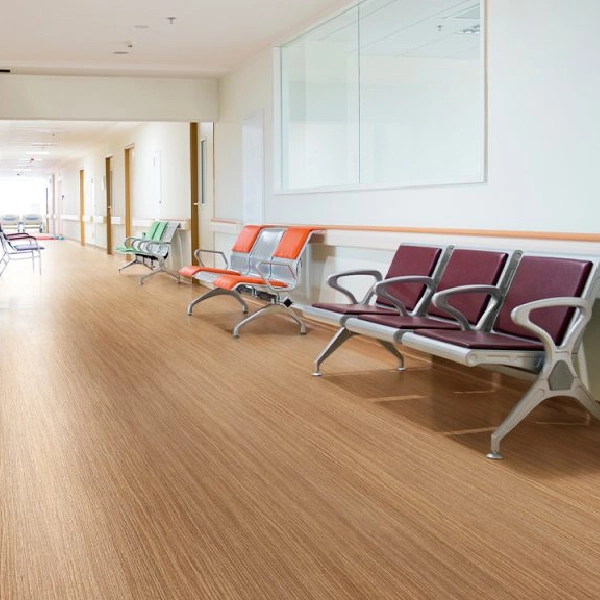 Light oak wood-grain vinyl sheet flooring in a hospital