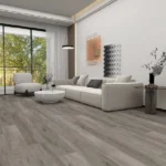 Living room with light grey, modern wood-look vinyl flooring.