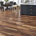 dark and light wood-look vinyl flooring in a kitchen.