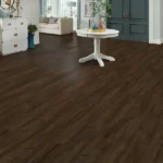 living room featuring dark brown, wood-look vinyl plank flooring.