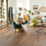 living room featuring warm-toned, wood-look vinyl flooring.